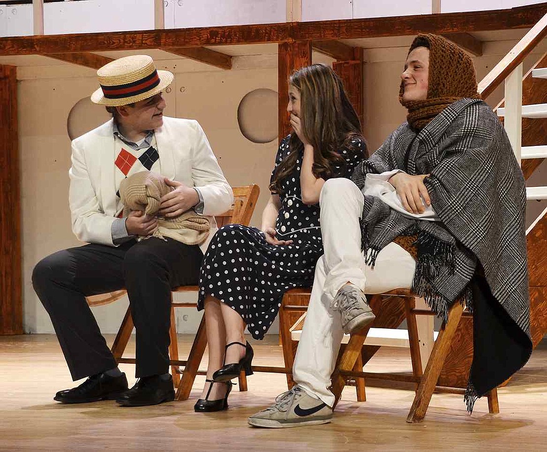 <p class="Picture">Sir Evelyn Oakleigh fails to recognize that his fianc&eacute;&rsquo;s love interest, Billy Crocker, is pretending to be an old woman by wearing a disguise. From left: senior Adam Newmark, senior Katy Comstock and junior Sammy Landino.</p>