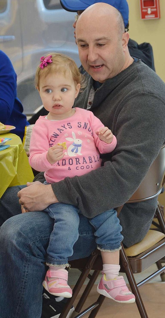 <p class="Picture">Eighteen-month-old Brooke Billig sits on her father Rich&rsquo;s lap at the family affair sponsored by the Rye Brook Recreation Department. The Billigs live on Red Roof Drive.</p>