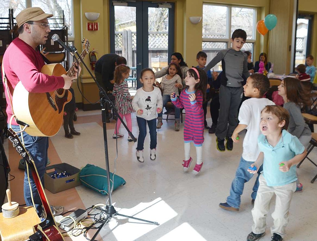 <p class="Picture">Kids shaking Easter eggs dance to the music of Zev Haber.</p>