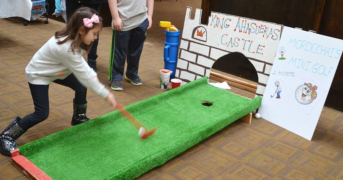 <p class="Picture">Gabby Gonzalez, 5&frac12;, tries her hand at mini golf at King Altasueras&rsquo; Castle.</p>