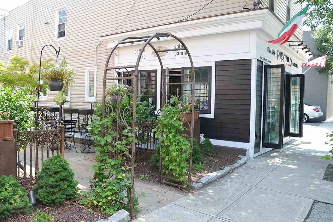  The well-landscaped patio and garden shared by Piccolo Italian Gourmet and nessa Ristorante