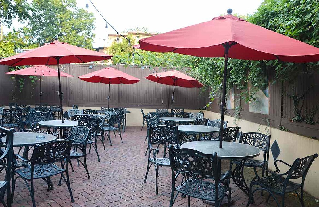  The enclosed red brick patio behind Michael's Famous Pan Pizza