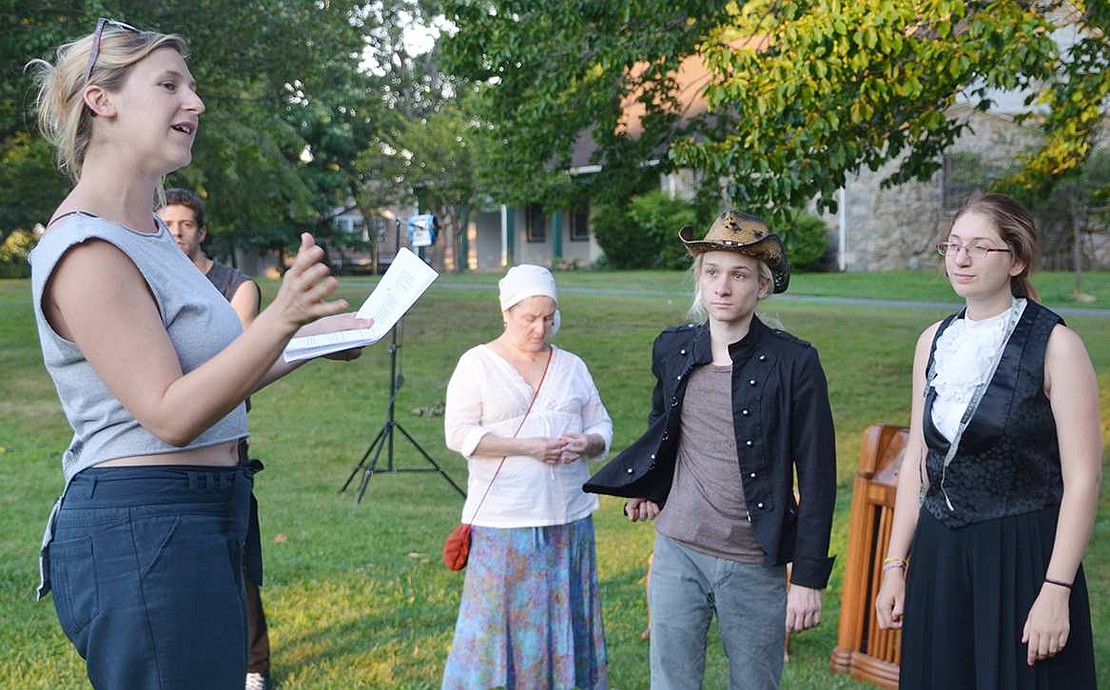 Emma Zakes Green (left), the show's director, gives her cast some notes before they begin rehearsal at Lyon Park on Tuesday, Aug. 4. 