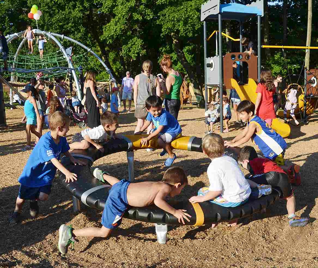 Families from all over the village gathered for the official opening of the new playground at Pine Ridge Park on Friday, Aug. 7 