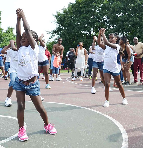 Members of the Little Weber Steppers perform a routine for family and neighbors during the Unity Day festivities. 