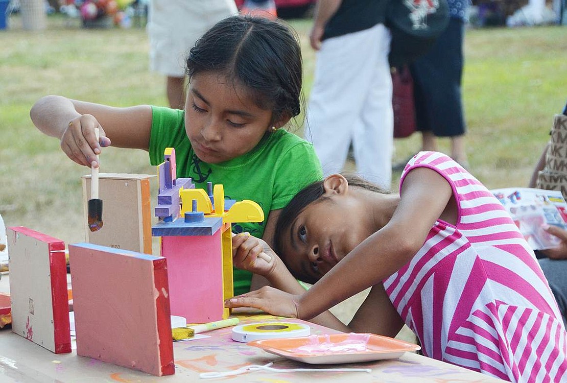  Port Chester girls Kally Vizhco (left), 8, and Diana Valdovinos, 7, paint a picture frame and a birdhouse at the project area set up by Home Depot, which hosts arts and crafts activities for children at their Midland Avenue store  on the first Saturday of each month. The 27th annual Port Chester Day at Lyon Park was held on a warm-but not too hot-Saturday, Aug. 29. 