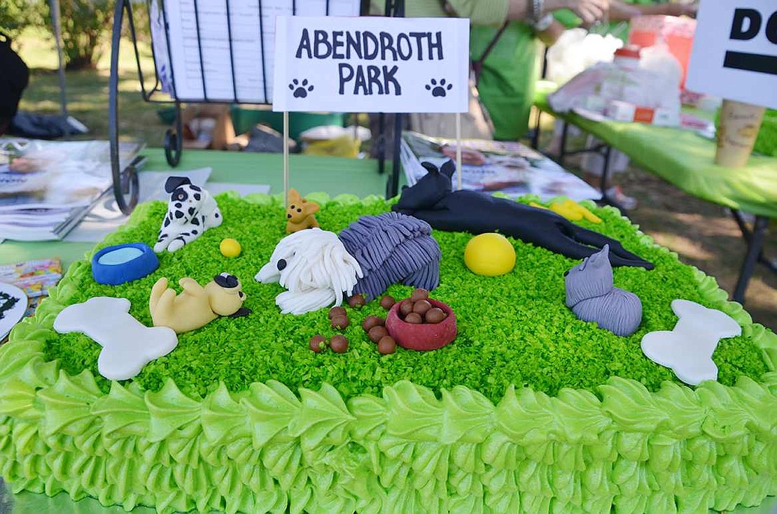 In honor of the dog park, Carmen Brito created a doggy-themed cake and donated it for the grand opening. 