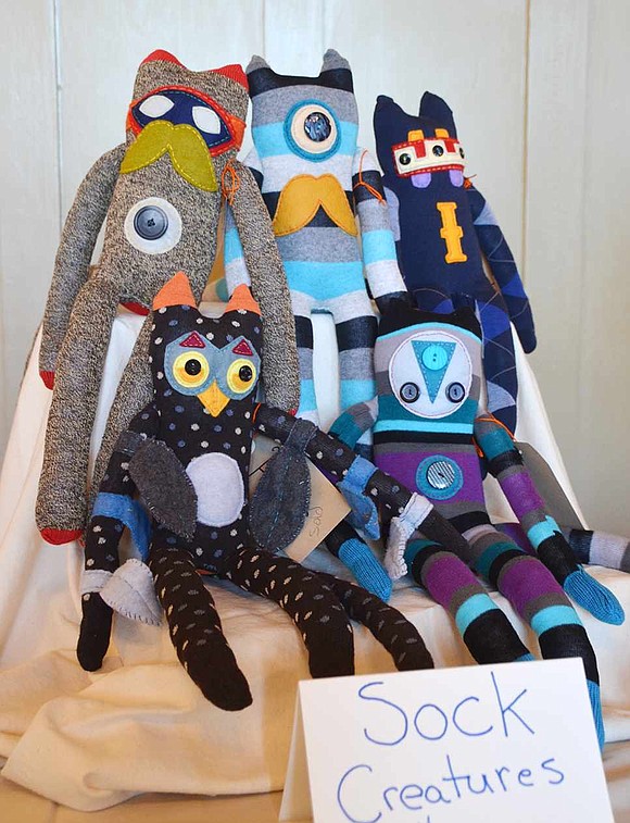  Five sock creatures, crafted by Port Chester's Paul M. Rively, Jr., sit in a pile together. 