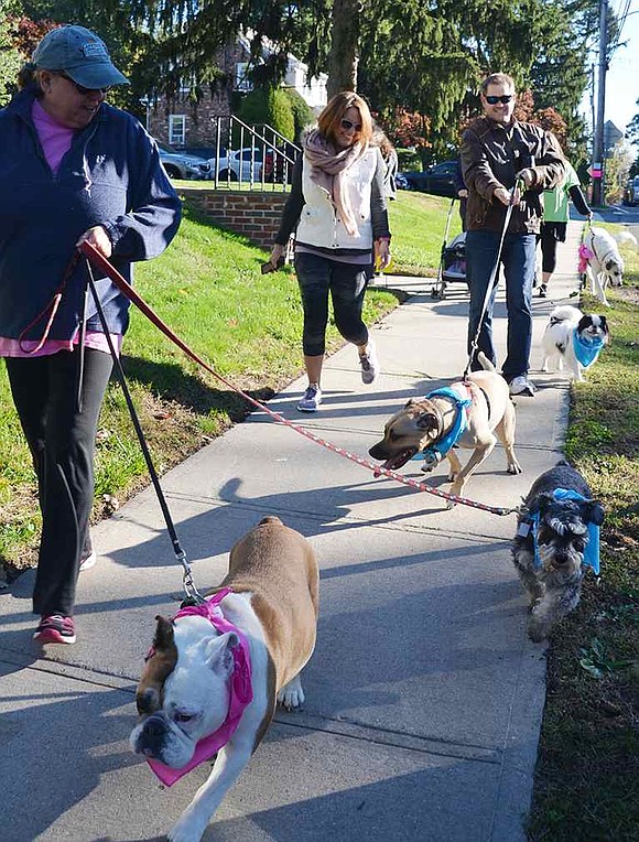 About 10 people-plus their frisky pups-took part in the new one-mile dog walk that preceded the annual 5K. 