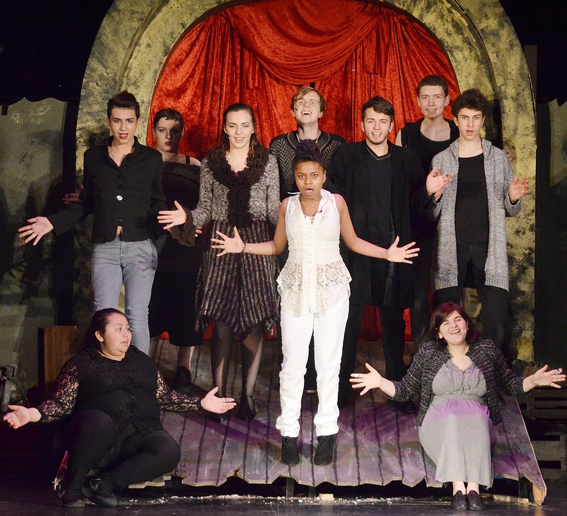 <p class="Picture">Briana Velazquez, dressed in stark white, and the rest of her theater troupe invite the audience to watch a show about a prince searching for fulfillment.&nbsp;</p>