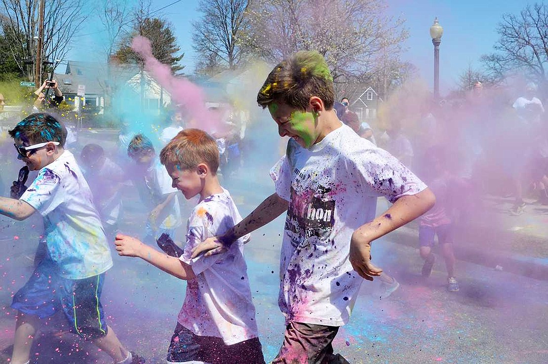 <p class="Picture">As the color run starts, students sprint through clouds of colorful dust.&nbsp;</p>