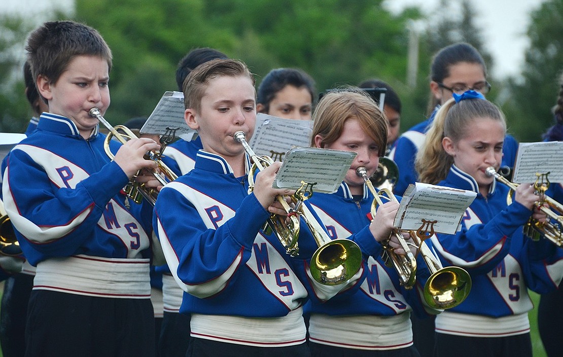 <p class="Picture">Members of the Port Chester Middle School sixth grade band perform a salute to American entertainer George M. Cohan during the 72nd annual Band Night at Port Chester High School on Monday evening, May 23. From left: William Manos, Daniel Hinz, Christopher Pascale and Sarah Tortorici.</p>