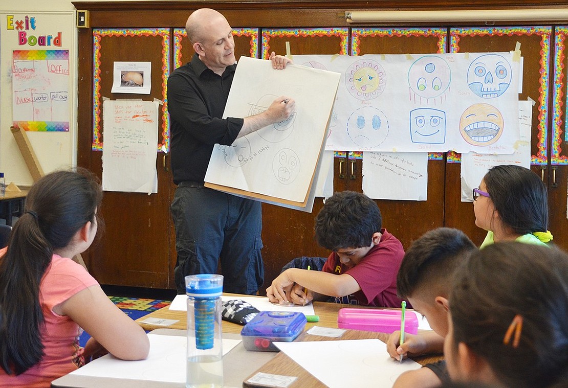 <p class="Picture">Paul Rively demonstrates how to draw an emoji for Park Avenue School fourth graders in Idia Saldana&rsquo;s class.&nbsp;</p>