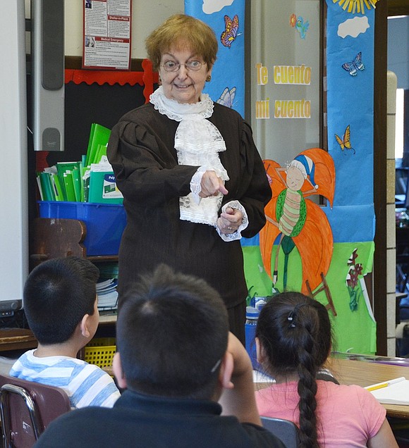 <p class="Picture">Dressed up as Lavinia Horton, Camille Linen describes what life was like for the 19<sup>th</sup> century woman to Park Avenue School fourth graders. Horton, a schoolteacher and the first female New York state school board member, is memorialized in a mural at the Port Chester post office and portrayed in the musical &ldquo;Flashbacks,&rdquo; about the history of Rye Town.&nbsp;</p>