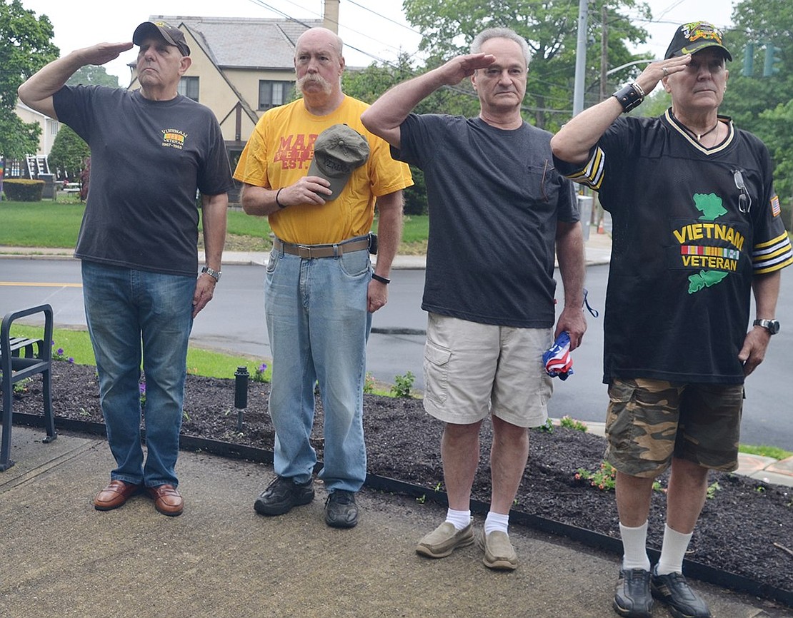 <p class="Picture">Vietnam veterans Peter Sileo of Rye Brook, William Sullivan of Port Chester, Steve Vespia of Rye Brook and Tom Giorgi of Rye Brook salute during the ceremony at the Vietnam War memorial in Lyon Park.</p>