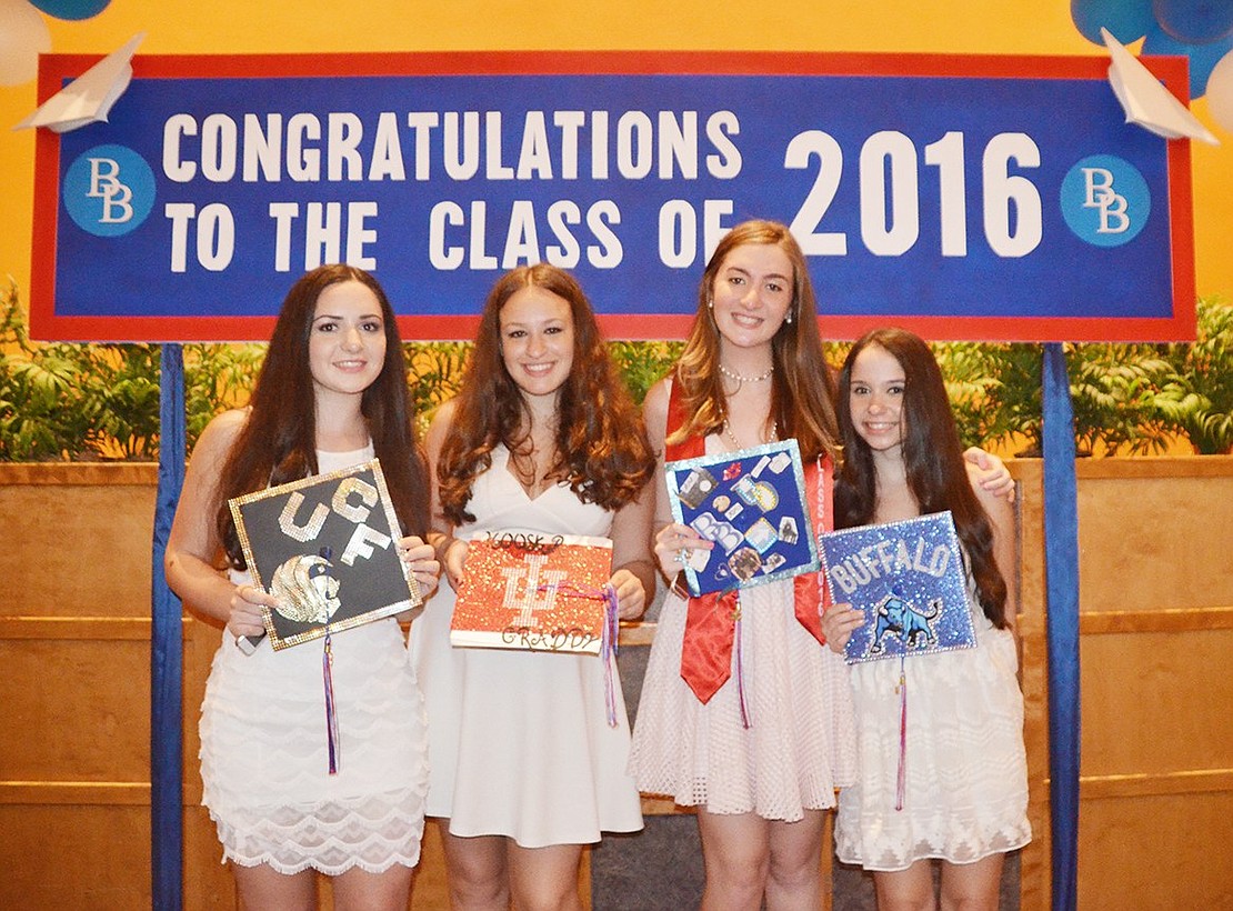 <p class="Picture">New Blind Brook graduates hold up their decorated caps showing where they will be heading this autumn. From left: Jessica Gallagher, Marni Levine, Liz Dubin and Emily Tazbin.&nbsp;</p>