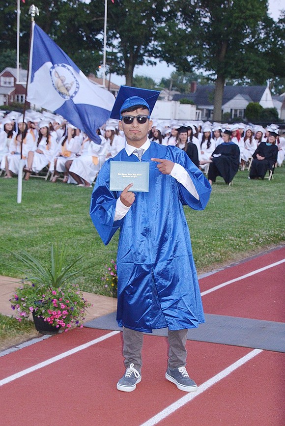 <p class="Picture"><span style="font-family: Arial, sans-serif;">Jack Palacios shows off his newly-acquired diploma.&nbsp;</span>Richard Abel|Westmore News</p>