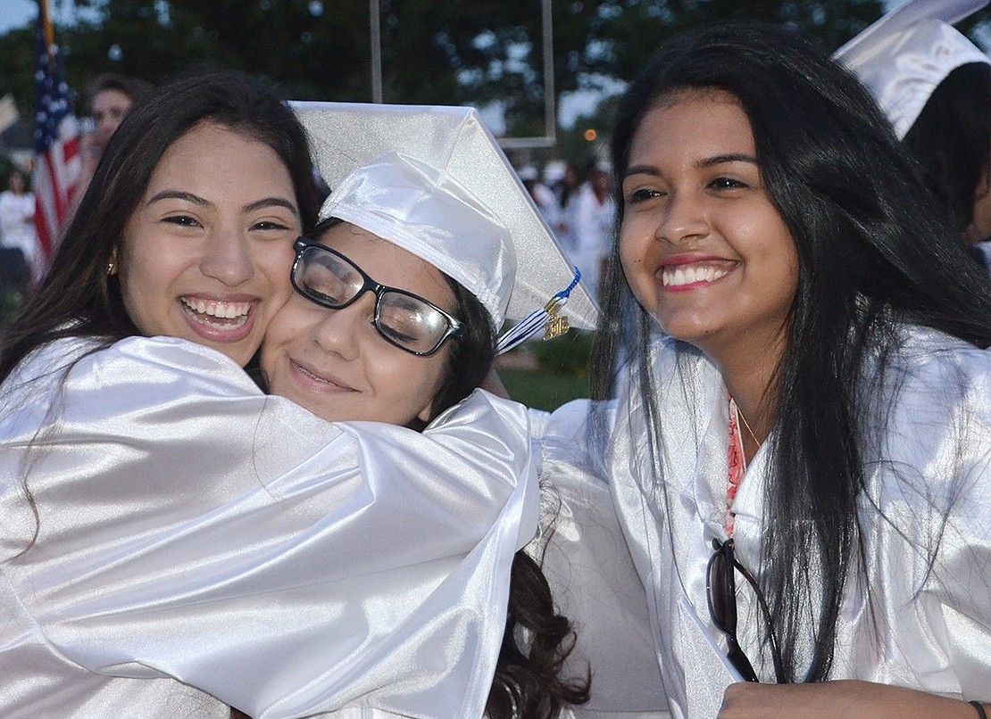 <p class="Picture"><span style="font-family: Arial, sans-serif;">Yolanda Hernandez, Perla Funez, the class president, and Erika Mendoza hug after commencement is over and they have been pronounced graduates of Port Chester High School.&nbsp;</span>Richard Abel|Westmore News</p>