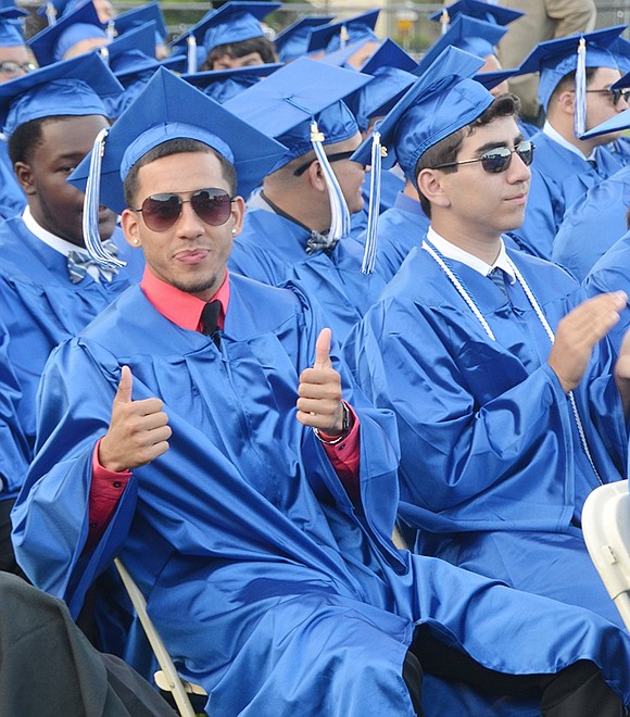 <p class="Picture"><span style="font-family: Arial, sans-serif;">Jonathan Garces gives two thumbs up during commencement.&nbsp;</span>Richard Abel|Westmore News</p>