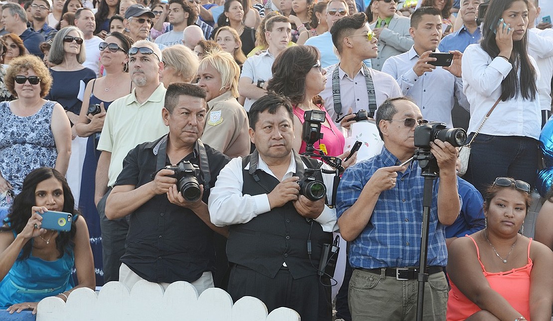 <p class="Picture"><span style="font-family:'Arial','sans-serif';">The scene at the Port Chester High School commencement on Friday, June 24 with female graduating seniors wearing white gowns in the foreground and the packed stands at Ryan Stadium in the background.&nbsp;</span>Richard Abel|Westmore News</p>