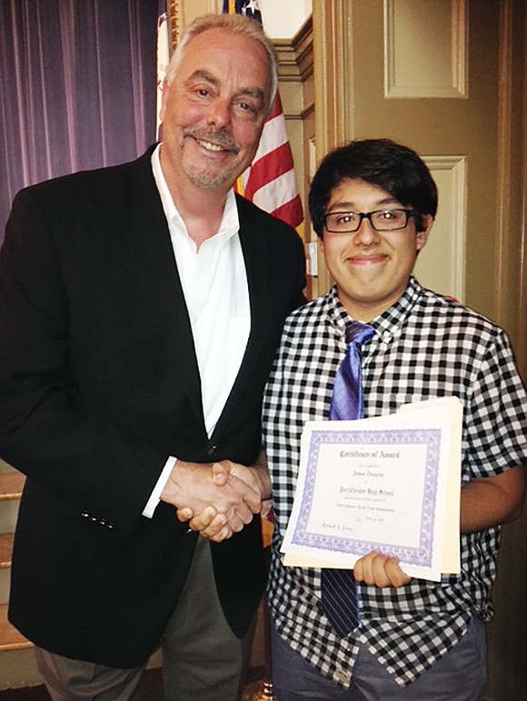 <p class="Picture"><span style="font-family: Arial, sans-serif;">Bob Sorensen presents the 2016 Port Chester Yacht Club $1,000 scholarship to Jesse Duarte. The Yacht Club has awarded scholarships for more than 20 years to Port Chester High School graduating seniors who plan to continue their education in marine biology, marine engineering or environmental studies. Duarte will attend Manhattan College in the fall where he will major in environmental science.</span></p> <span style="font-family: Arial, sans-serif;">Courtesy of Bob Sorensen</span>