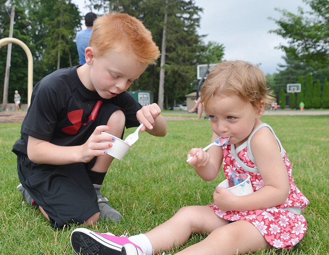 <p class="Picture">Not one young face was spared from being smeared with ice cream in Pine Ridge Park on Friday, July 8. Parents snuck a bite or two of their kid&rsquo;s ice cream as the child dragged them over to the swing set or took off their shoes for the bounce house. Little girls spun and sang at the top of their lungs when Disney&rsquo;s hit &ldquo;Let it Go&rdquo; played on the speakers. This was all thanks to Ice Cream Fridays, an event the Village of Rye Brook is hosting every Friday in July at 6 p.m.</p> <p class="Picture"><span style="font-family: Arial; font-size: 13px;">Siblings Andrew, 6, and Eloise Burns, 2, of Westview Avenue don&rsquo;t want to share their ice cream with anyone. Photos by&nbsp;Casey Watts|Westmore News</span></p> &nbsp;