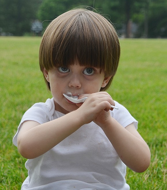 <p class="Picture">Three-year-old Armett Street resident Luke Melone isn&rsquo;t afraid to get his face sticky as he enjoys every bite of his vanilla ice cream.&nbsp;</p>