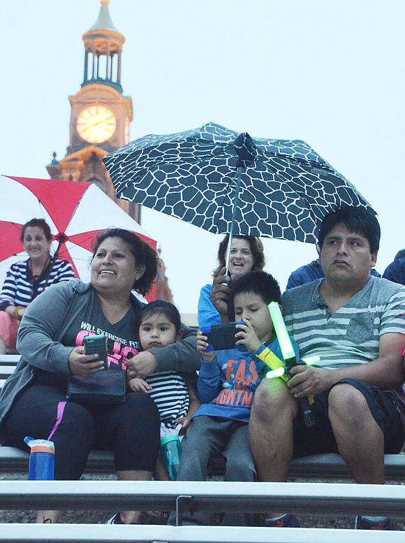 <p class="Picture">From left, Margarita Puipialli, Yamileth Aguilar, 2, Gianpiero Barzola, 5 and Cesar Barzola take in the Independence Day festivities. Yamileth lives on South Regent Street, the others on Grove Street.</p>