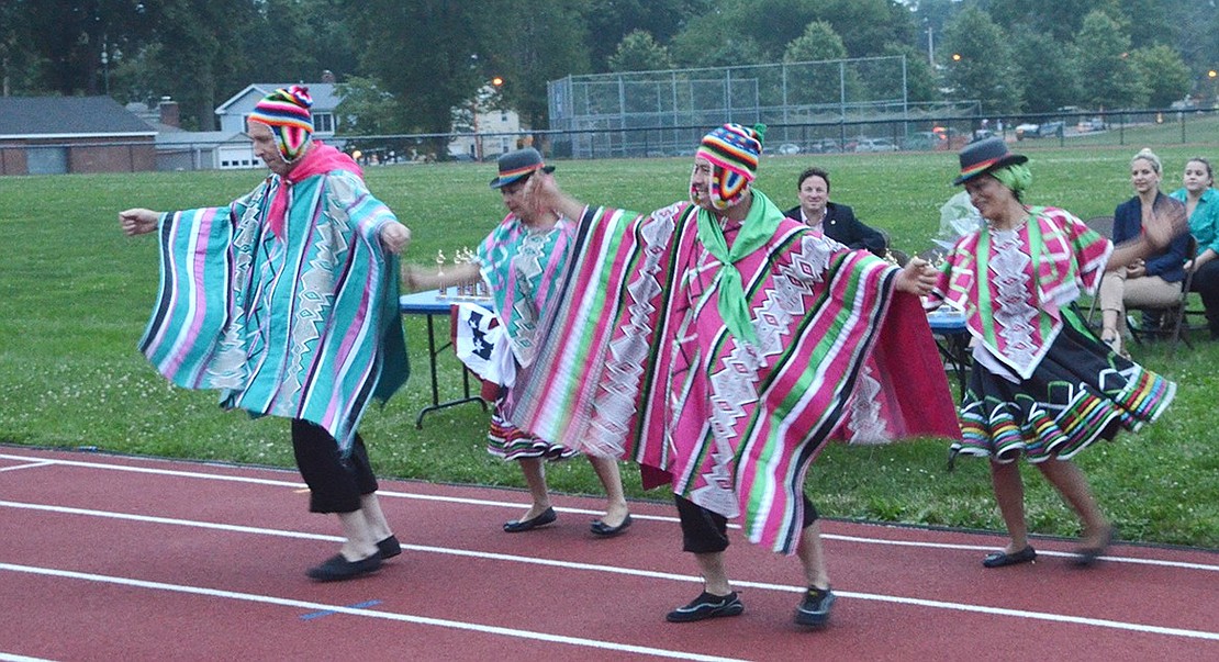 <p class="Picture">Members of the Alma Solana Dance Group perform in colorful costumes.&nbsp;</p>