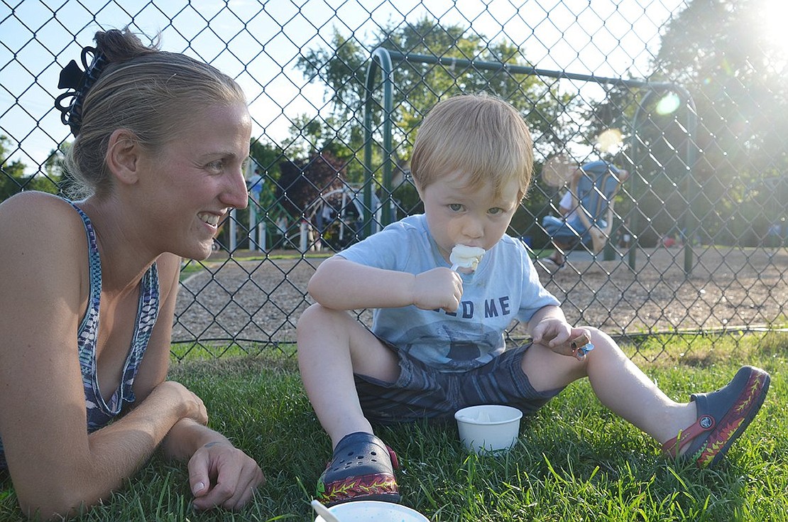 <span style="font-family: Arial;">Rye Brook residents Connor Ware, 3, and his babysitter Anne Alleva beat the heat with free ice cream.</span>