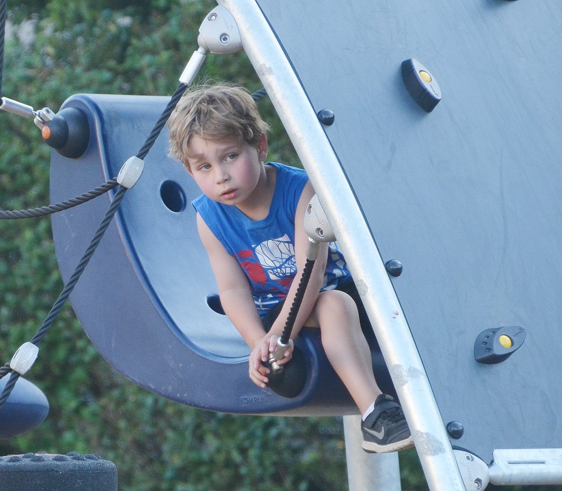 <p class="MsoNormal">Wally Pohlman, a 5-year-old Rye Brook resident, returns for his second Ice Cream Friday. He particularly liked lounging behind the new rock wall near the rope course.&nbsp;</p>