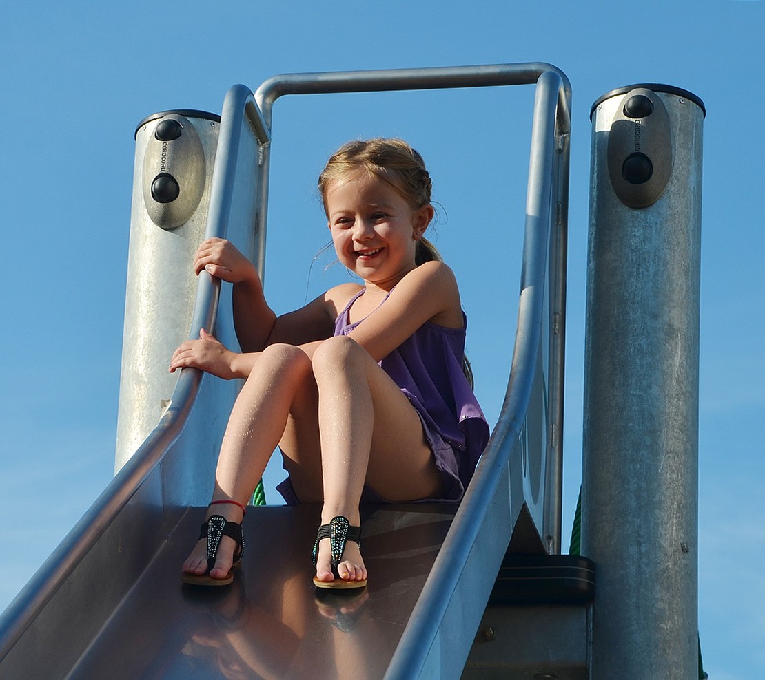<p class="MsoNormal">Danielle Elkowitz, a 6-year-old Rye Brook resident, braved the rope ladder to climb to the top of the slide at Garibaldi Park&rsquo;s new playground on Friday, July 15 during Rye Brook&rsquo;s Ice Cream Fridays event. Despite the scalding hot metal, she slid down with a shout of glee and landed in her mother&rsquo;s arms. Photo story by Casey Watts.&nbsp;</p>