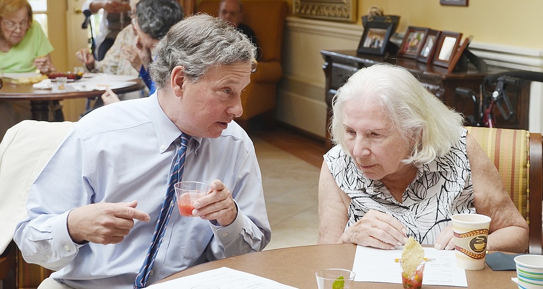 <p class="Picture">New York State Assemblyman and honorary judge Steve Otis talks with Atria Rye Brook resident Joan Klempner about what they think is in the watermelon soup. The secret ingredient was fresh mint picked from Scott Moore&rsquo;s garden. Otis loved it and thought it was the best thing served during the competition.&nbsp;</p>