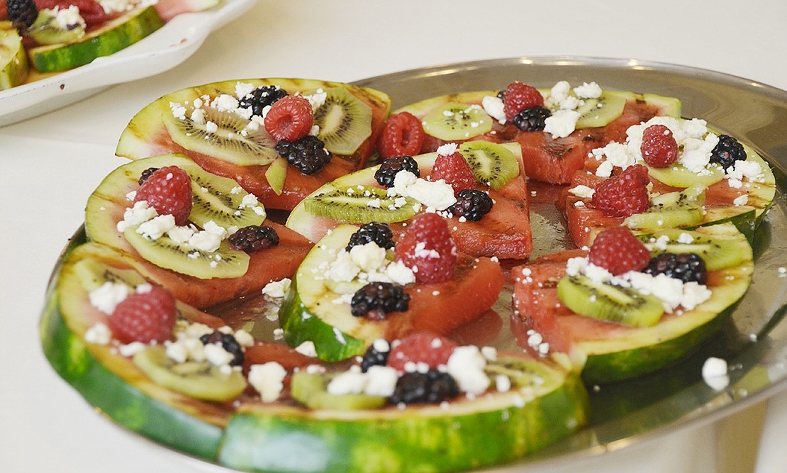 <span style="font-family: Arial;">Atria Rye Brook residents had a five-dish feast of watermelon-themed food for the Iron Chef competition on Thursday, July 14. Atria Chef Jorge Cambre made grilled watermelon pizza topped with feta cheese, cucumbers, raspberries and blackberries.&nbsp;Photo story by Casey Watts.</span>