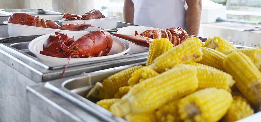 <p class="Picture">Lobster and corn on the cob were prepared right in front of attendees.</p>