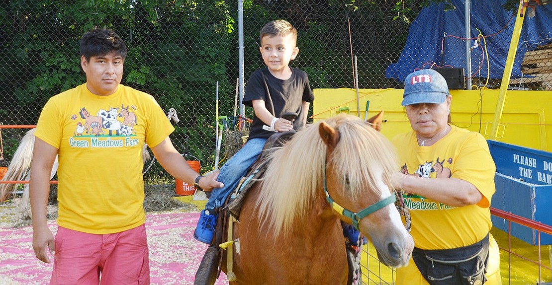 <span style="font-family: Arial;">Kevin Rodriguez, 4, of Port Chester, rides a pony from Green Meadows Farm.&nbsp;</span>