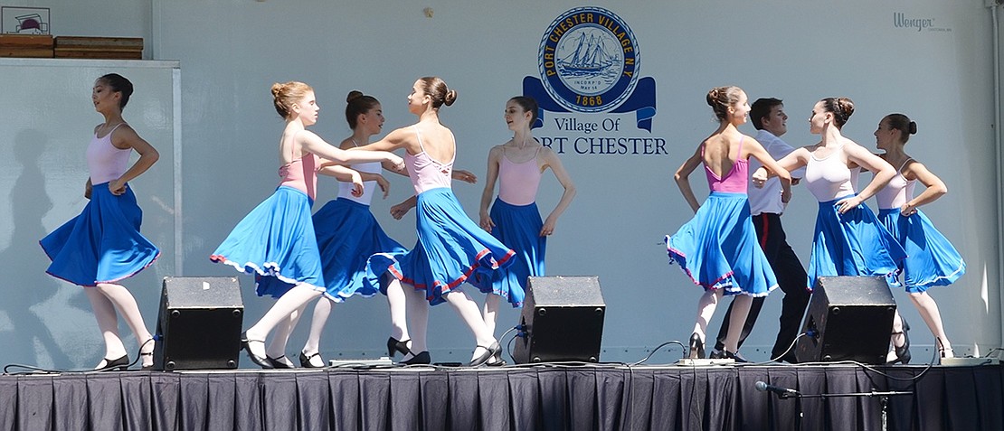 <p class="Picture">Ballet des Am&eacute;riques dancers demonstrate their skills by connecting arms and circling one another as their blue skirts flare. </p>