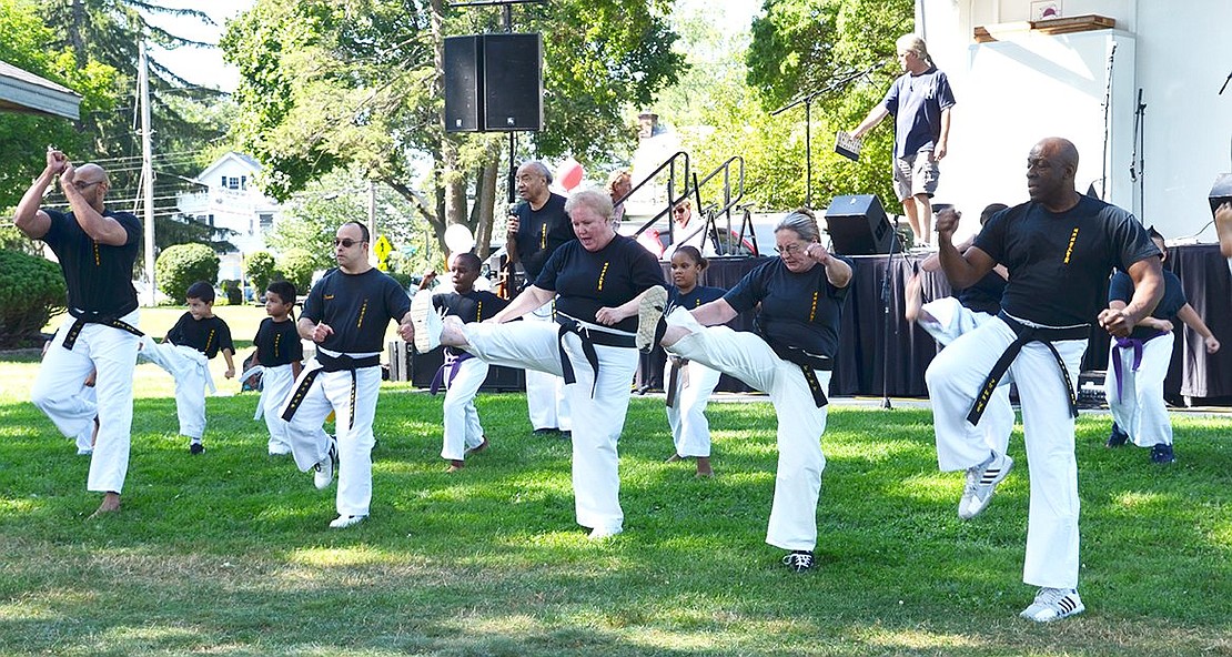 <p class="Picture">Rico Dos Anjos Karate students kick away the invisible competition during their demonstration.&nbsp;</p>