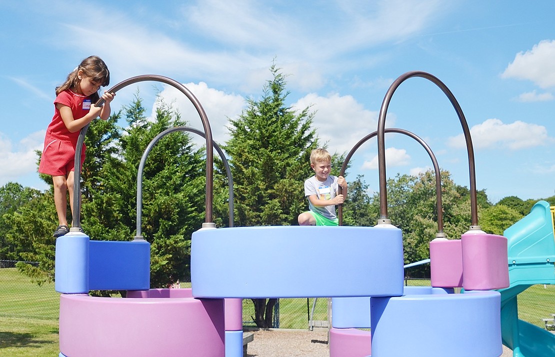 <p class="Picture">Port Chester residents Samantha Beadle, 5, of Pine Place and 4-year-old Ryan McRedmond of Bolton Place test their climbing abilities.</p>