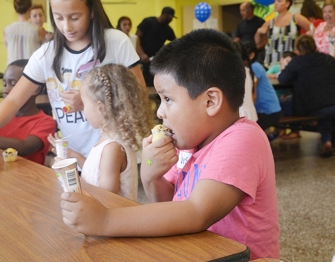 <p class="Picture">Luis Felipe, who is attending John F Kennedy&rsquo;s Early Learning Center, enjoyed his chocolate chip muffin more than his fruit pop. The kindergartener opted for a mouthful of muffin and one cold hand instead of a brain freeze.&nbsp;</p>