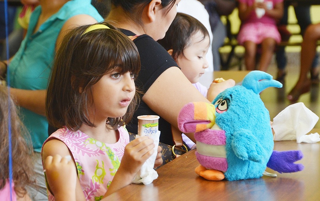 <p class="Picture">Six-year-old Agatha Martins enjoys her third Whole Fruit pop at John F. Kennedy&rsquo;s Early Learning Center. In the stuffy cafeteria, this rising kindergartener sure knew how to stay cool.&nbsp;</p>