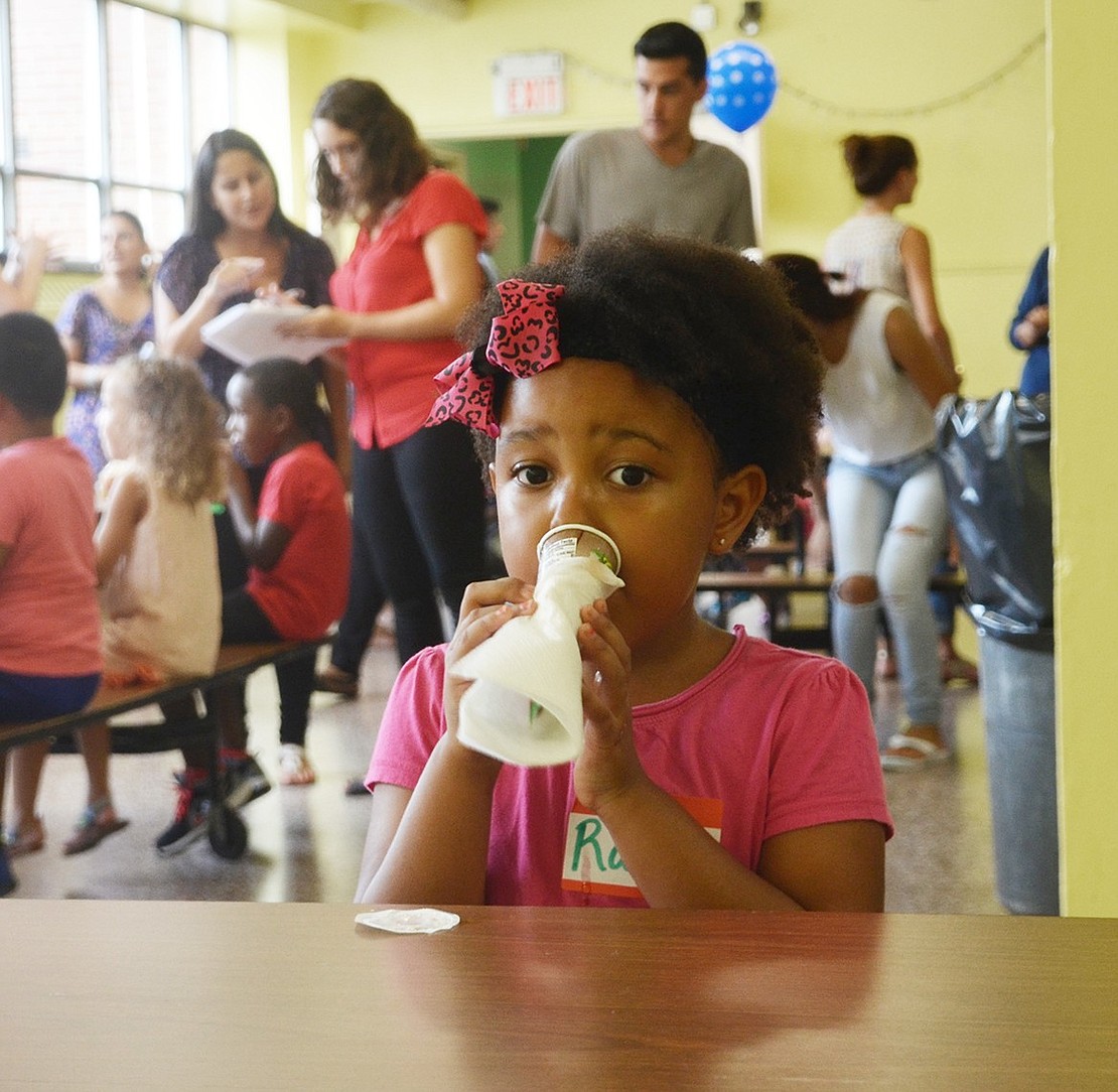 <p class="Picture">Rachael Perez, 5, dives into her Whole Fruit popsicle face first. The new Early Learning Center student got her face all sticky at the ELC&rsquo;s kindergarten ice cream social on Thursday, Sept. 1, but she didn&rsquo;t care one bit.&nbsp;</p>