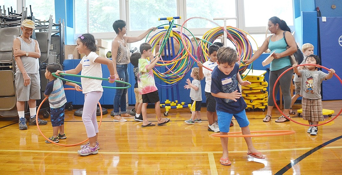 <p class="Picture">The rain didn&rsquo;t stop the fun. King Street School moved the ice cream social inside to their gym and had hula hoops and yellow scooters for the kids to use while they were on a sugar rush.</p>