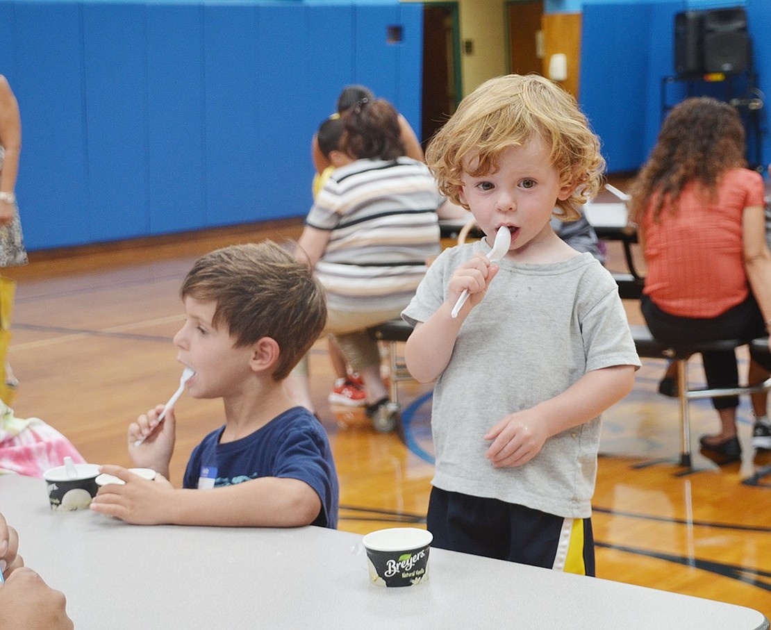 <p class="Picture">For the Brescio family, Sept. 1 was all about 5-year-old Luke, who was about to start kindergarten at King Street School. He and his brother James, 2, thoroughly enjoy stuffing their mouths with ice cream during King Street School&rsquo;s kindergarten ice cream social.&nbsp;&nbsp;</p>