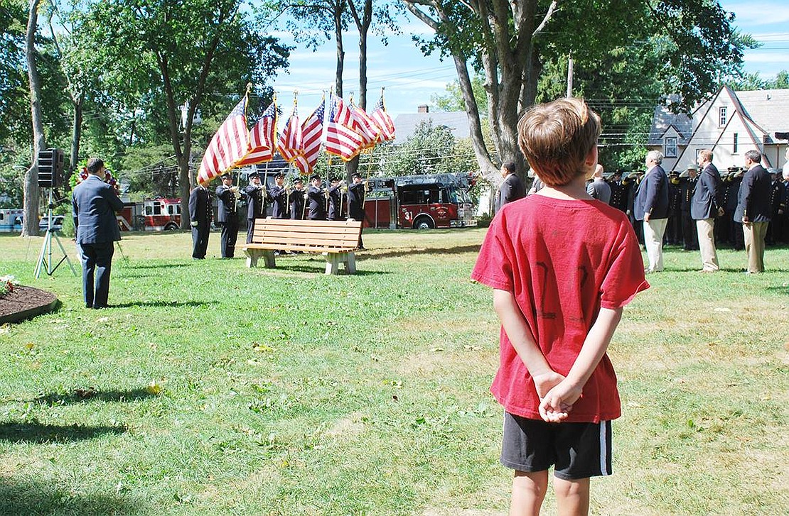 <p class="Picture">A boy too young to have seen the tragic events of Sept. 11, 2001, stands tall as he pays respect to the heroes he never knew.</p> <p class="Right">Richard Abel|Westmore News</p>