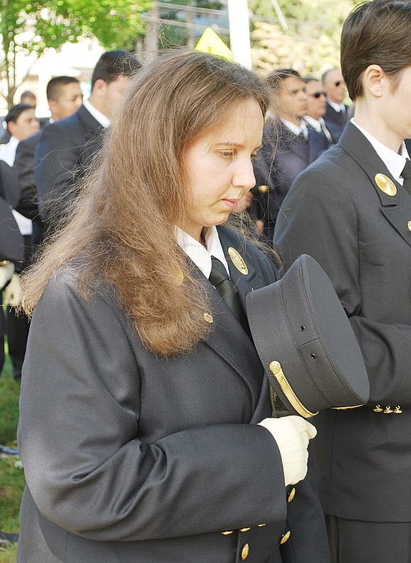 <p class="Picture">Port Chester volunteer firefighter Ami Lori, a member of Brooksville Engine &amp; Hose Co. No. 5, bows her head during a prayer.</p> <p class="Right">Richard Abel|Westmore News</p>