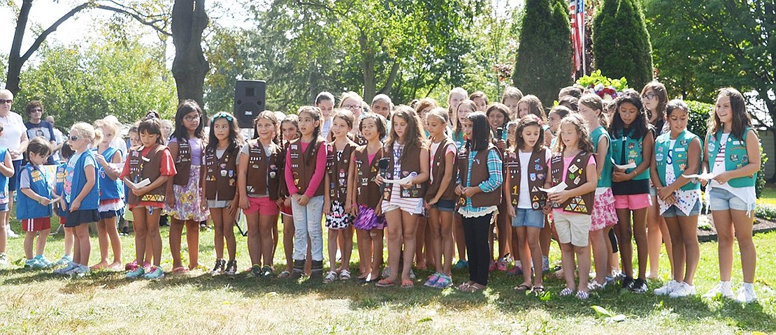 <p class="Picture">Port Chester and Rye Brook Girl Scouts stand in front of the memorial and sing &ldquo;God Bless America&rdquo; to close the commemorative ceremony.</p> <p class="Right">Casey Watts|Westmore News</p>