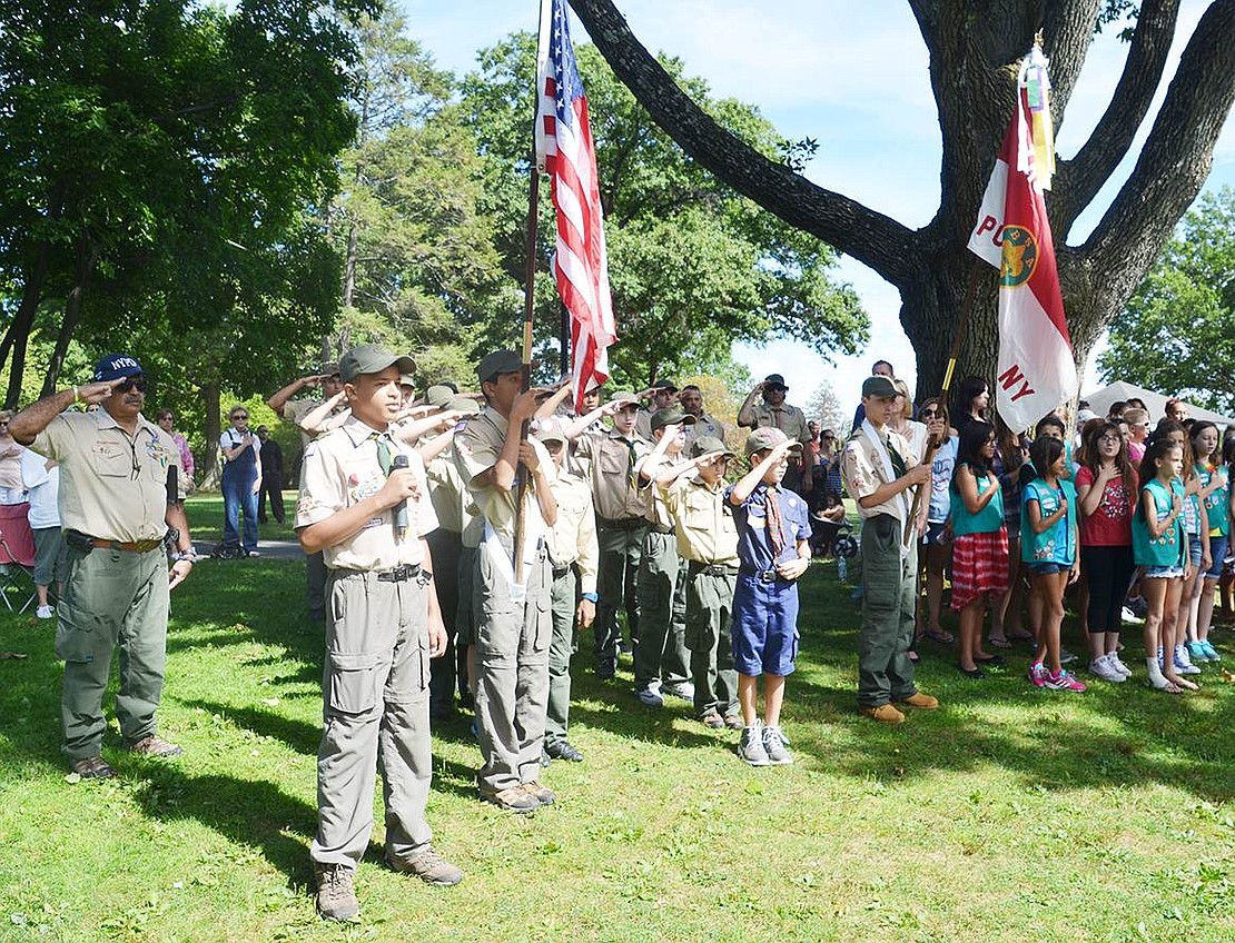 <p class="Picture">Port Chester Boy Scouts and Cub Scouts recite the Pledge of Allegiance to the seven flags held by members of the Port Chester Volunteer Fire Department.</p> <p class="Right">Casey Watts|Westmore News</p>