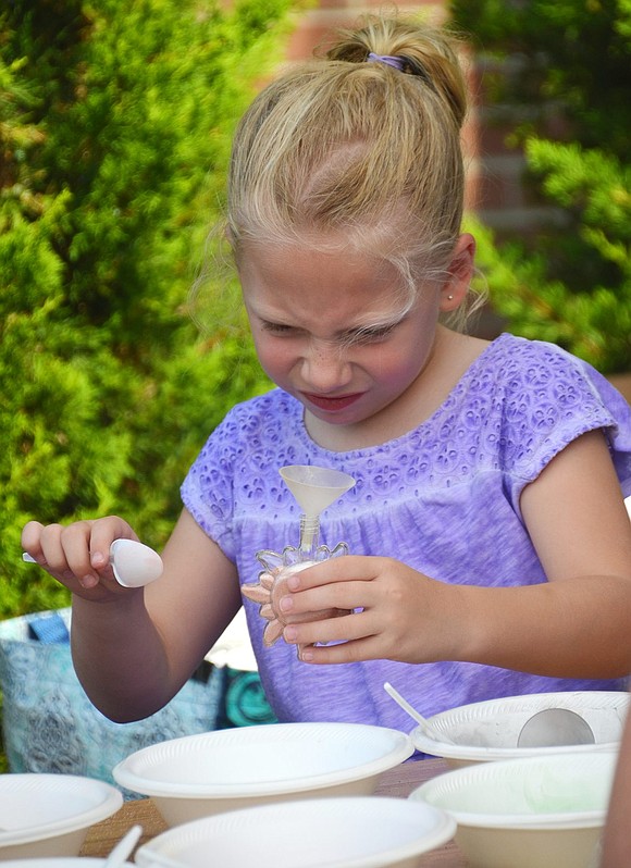 <p class="Picture">Veronica Scullion, 6, of South Regent Street concentrates intently on making a sand art creation at the Fall Fling on Saturday, Sept. 10 at St. Paul&rsquo;s Lutheran Church in Rye Brook. Photo story by Jananne Abel.&nbsp;</p>