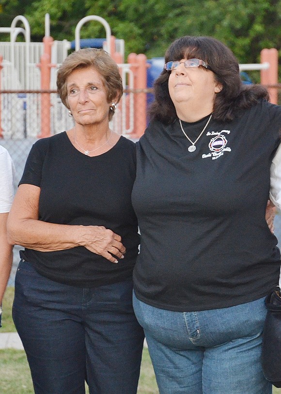 <p class="Picture">Jackie McNeill (left) and Shari Melillo watch their balloons dance across the sunset above Port Chester High School. McNeill lost her son Patrick 19 years ago after he went missing for 50 days on Feb. 16, 1997. His body was found on April 17 in the East River. &ldquo;You learn to live with a broken heart every day,&rdquo; McNeill said. Melillo&rsquo;s son Charlie was 27 when he passed away on Oct. 21, 2012 from a head injury he received playing football.&nbsp;</p>
